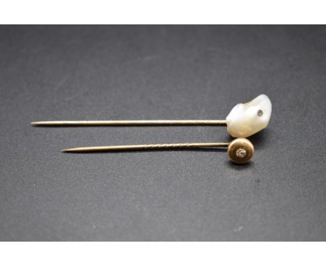 A diamond stick pin; together with another yellow metal stick pin, set baroque pearl, stamped '585'. (2) 