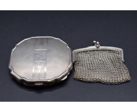 An engine turned silver powder compact, by&nbsp;W I Broadway &amp; Co, Birmingham 1938, 6.9cm diameter; together with a small