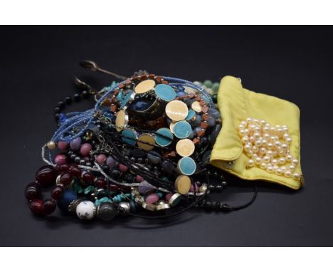 A single strand cultured pearl necklace, having clasp stamped 14k, 71cm; together with a malachite bead necklace; a jadeite b