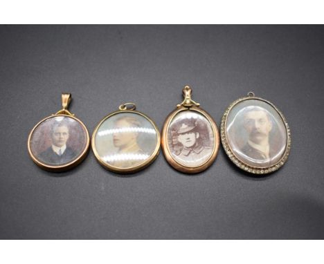 Two portrait pendants having yellow metal frames, stamped 9ct; together with another engine turned yellow metal example; and 