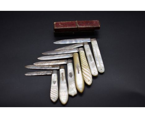 Seven silver and mother of pearl fruit knives, two cased. 