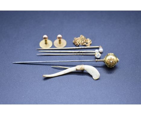 A diamond set yellow metal stick pin; together with a two pearl set stick pins; a Victorian yellow metal and steel hat pin an