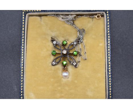 An Edwardian diamond and peridot pendant with pearl drop, 27mm, in a D &amp; J Wellby fitted case. 