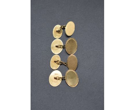 A pair of 9ct gold oval engine turned cufflinks, by H.G &amp; S, Chester 1930, 5g; together with a similar smaller pair, 5.9g