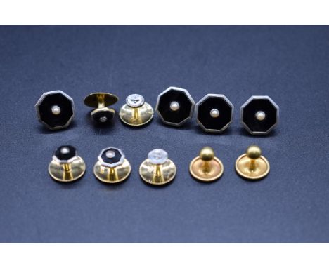 Four yellow metal black onyx and split pearl buttons, stamped 18ct; together with three similar studs; and four other studs s