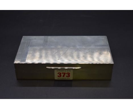 An Art Deco engine turned silver cigarette box,&nbsp;by Asprey, London 1937, 16.5cm long. 