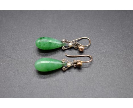 A pair of Art Deco jade earrings, set with four small diamond chips and a single pearl, 2.5cm. 