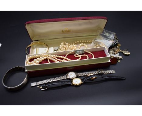 A carnelian set pendant seal; together with three ladies wristwatches; a silver hinged bangle; and various other jewellery. 