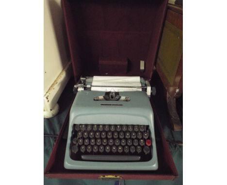 A Vintage Olivetti Studio 44 Portable Typewriter. 