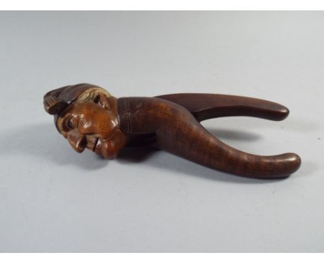 A Carved Continental Wooden Nut Cracker.  