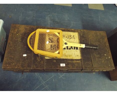 A Metal Travelling Trunk and Tennis Racquet. 
