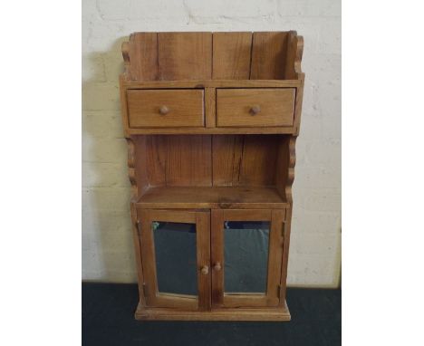 A Pine Wall Hanging Cabinet with Two Drawers Shelf and Mirrored Cupboard Base. 