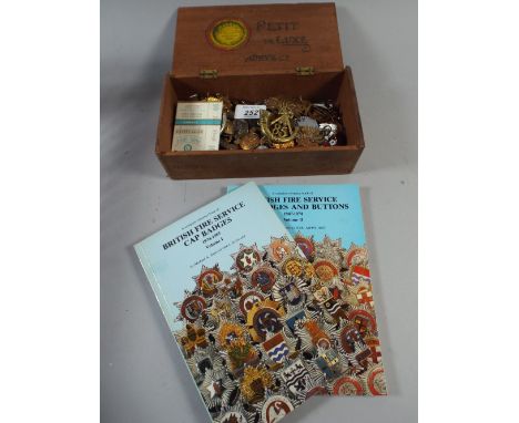 A Cigar Box Containing Military Badges Enamel Badges and Two Books British Fire Service Cap Badges Volume 1 and Volume 2. 
