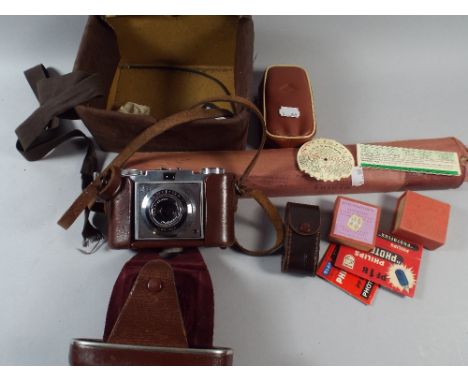 A Leather Cased Zeiss Icon Camera with Light Meters, Accessories and Tripod. 