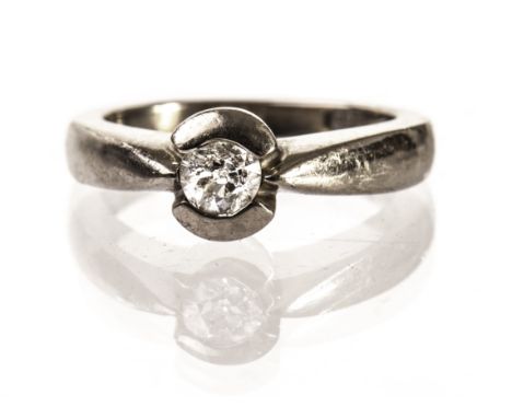 An 18ct gold and diamond solitaire engagement ring, the modern mount supporting an old cut stone, hallmarked