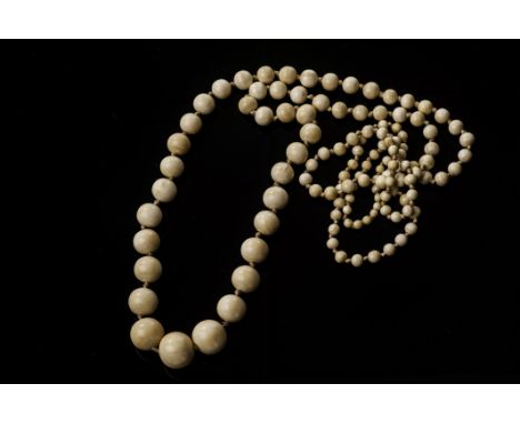 A 1930s ivory ‘Charleston’ necklace the long string of graduated beads measures 129.5cm total length (65cm drop)