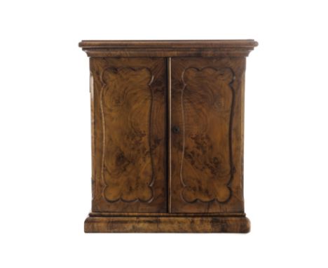 A good 19th century mineralogists cabinet, constructed of mahogany and with walnut veneer, the panel doors are secured with a