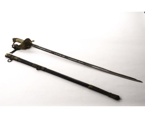 A George V Naval Officer’s sword, having lions head pommel and gilt guard with white shagreen grip, engraved blade, presented