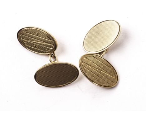 A pair of 9ct gold cufflinks, having engine turned oval panels united by chain links (2)