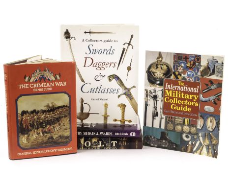 A collection of gun, sword, medal and militaria reference books, including The Complete Handgun by Ian V. Hogg, Collecting An