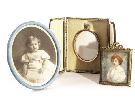 A vacant portrait miniature frame and fitted case, together with an Edwardian portrait miniature of a young boy, possibly on 