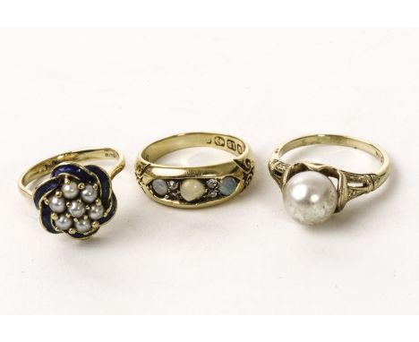 Three gold and gem set dress rings, including an 18ct gold, opal and diamond example, a pearl solitaire in 14k marked mount a