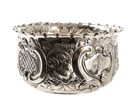 A late Victorian silver bowl, possibly by Henry Wilkinson, having embossed designs, dated Sheffield 1895