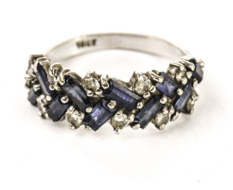 A retro sapphire and diamond dress ring, the tablet set with rectangular blue cut stones and brilliant cut diamonds, in an 18