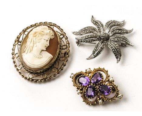 A 9ct gold and shell cameo brooch, together with a pretty gilt metal, amethyst and seed pearl style brooch and a white metal 