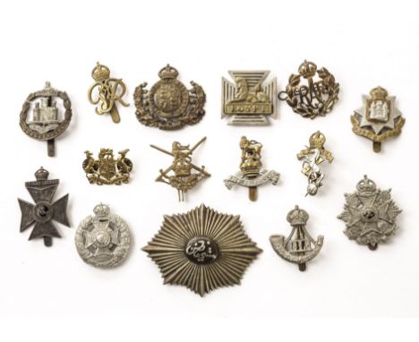 A substantial collection of British and allied military cap badges, including Norwegian army cap badge, bagpipe cap badge, Hi