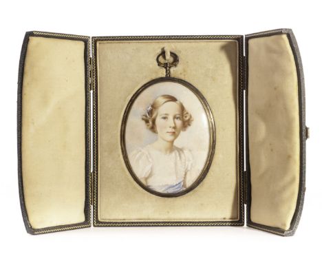 A George VI silver mounted portrait miniature by Murriel Smith, the well painted portrait of a young girl in oval case, signe
