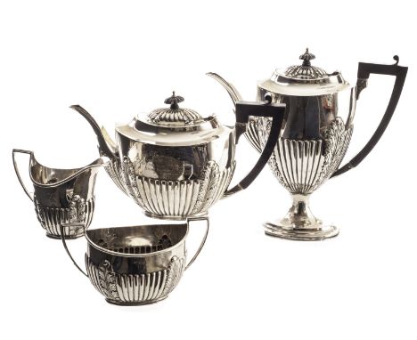 An Edward VII silver four piece tea set from the Alexander Clark Manufacturing Co, decorated in the Adam style having gadroon