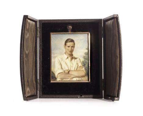 An Art Deco period portrait miniature, the rectangular gold plated frame having a portrait of a young man, in fitted case
