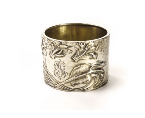 A German Art Nouveau silver napkin ring, with raised lily pad and whiplash designs, marked 800