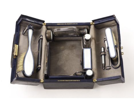 A John Collard Vickery lady’s fitted miniature motor bag, in blue Moroccan leather, and with silver mounted blue and white en