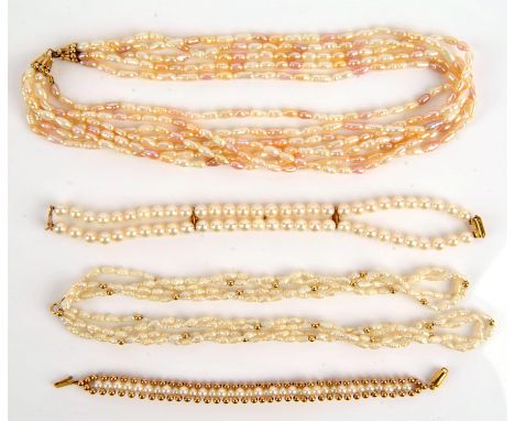A collection of pearl items, including a multi strand freshwater pearl necklace with cream pearls with pink overtones, with a