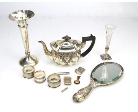 Small embossed silver teapot, Chester 1889, silver backed "Cherub" hand mirror, Chester 1903, glass and silver trumpet vase, 