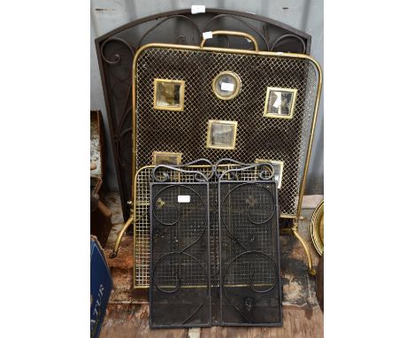 Brass and mesh firescreen, early 20th Century, 75cm high, together with an iron and mess screen with two flaps, and two addit