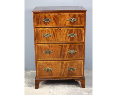 An Edwardian mahogany chest of drawers, inlaid with satinwood banding and stringing, the four graduated drawers on bracket fe