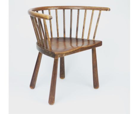 An Edwardian ash and alder child's chair, of stick back form and with solid seat and tapered legs