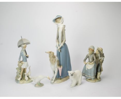 A group of ten Lladro porcelain figures, to include a large figure of a lady with greyhound, a young girl with umbrella, a yo