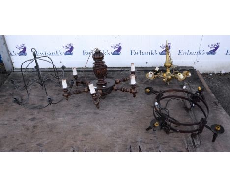 A large Baroque style stained beechwood hanging light, with six turned candlearms, together with a smaller brass example, 17t