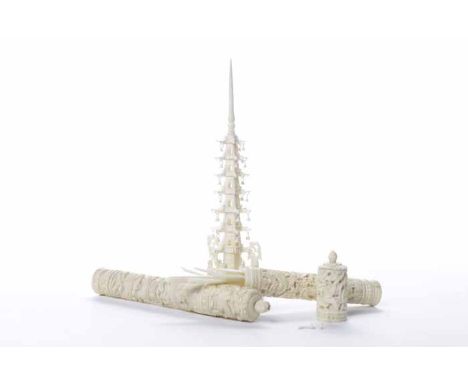 TWO EARLY 20TH CENTURY CHINESE IVORY CROCHET TOOL CASES
of cylindrical form, both carved with dragons, containing ivory tools