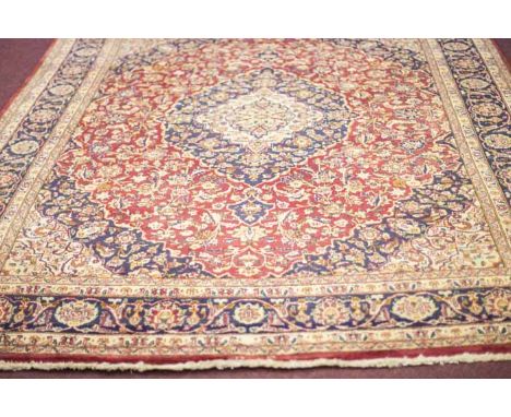 MASSHAD BORDERED CARPET
decorated with a large central lozenge shaped floral medallion, 343cm long, 238cm wide

