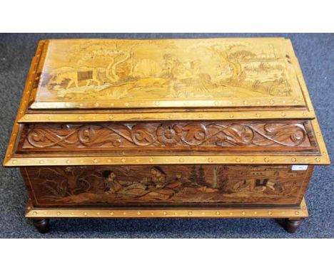 EARLY 20TH CENTURY SMALL INDIAN INLAID WOOD TRUNK
with figural scenes to the lid and body, on four feet, 80cm wide, 46cm high