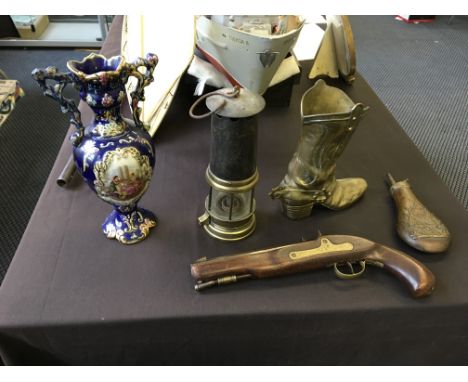 A powder flask, reproduction pistol, miners lamp, brass boot and vase.