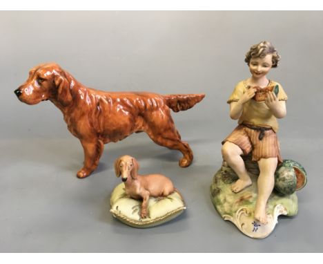 A Capodimonte seated dog on cushion and boy eating watermelon with Royal Doulton Irish setter.