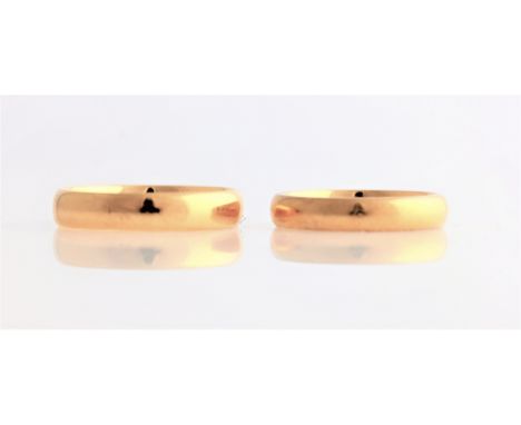 Two wedding bands, one hallmarked 22ct yellow gold, the other indistinctly stamped, ring sizes K½, and Q.