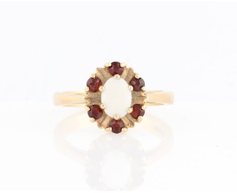 A hallmarked 9ct opal and garnet ring, ring size O.