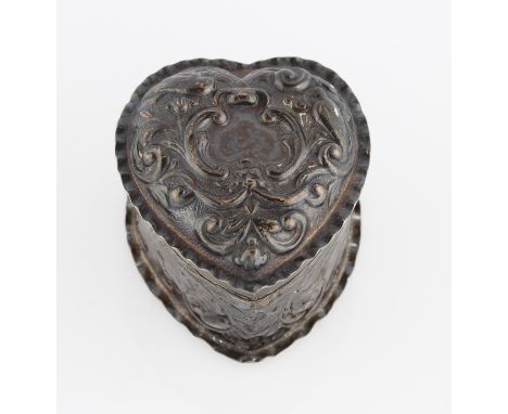 A Victorian silver heart trinket box, of scrolling repousse design, hallmarked London 1888, width approx. 4.5cm.